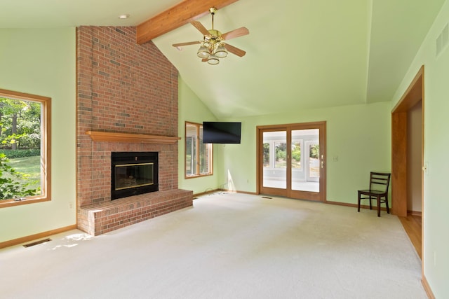 7184 Steeplechase Dr, Saline, MI 48176 - unfurnished living room featuring beamed ceiling, a fireplace, a ceiling fan, carpet, and high vaulted ceiling