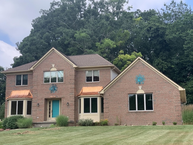 7184 Steeplechase Dr, Saline, MI 48176 - view of front of house featuring a front lawn, brick siding, and a shingled roof