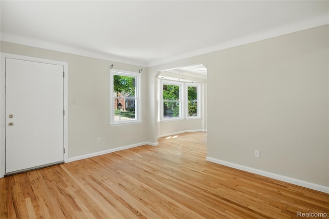 14888 Belmont Ave, Southgate, MI 48101 - spare room with light wood-type flooring and arched walkways