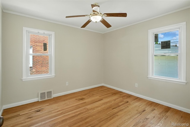 14888 Belmont Ave, Southgate, MI 48101 - unfurnished room with light wood-type flooring, crown molding, and a ceiling fan