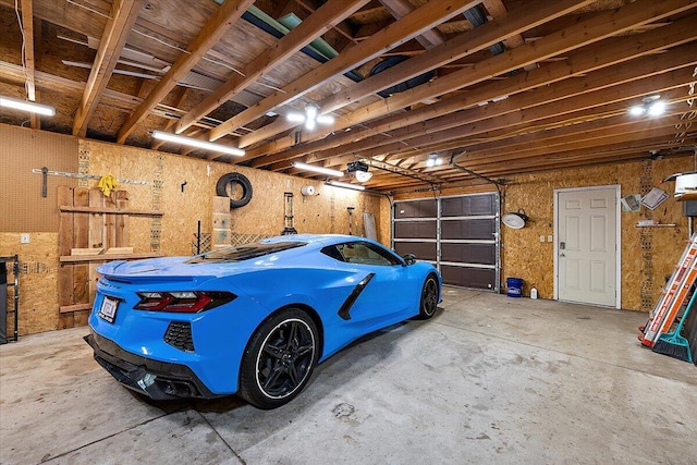 9950 Carpenter Rd, Milan, MI 48160 - garage featuring a garage door opener