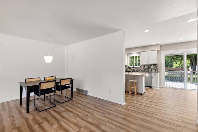 9950 Carpenter Rd, Milan, MI 48160 - dining space with light wood-style flooring and recessed lighting