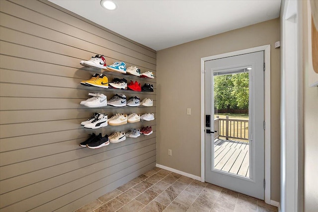 9950 Carpenter Rd, Milan, MI 48160 - entryway with wood walls and baseboards