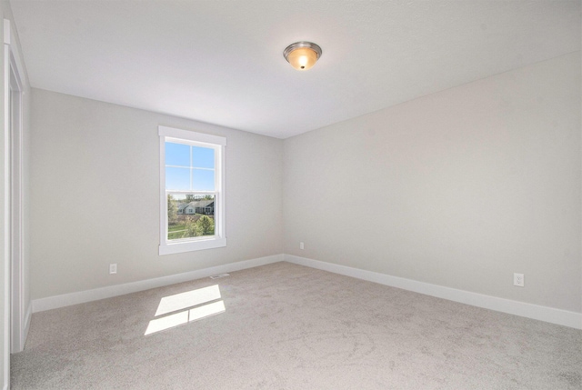 7457 Traditional Ct, Caledonia, MI 49316 - spare room featuring light colored carpet and baseboards