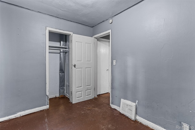 16934 Pembroke Ave, Detroit, MI 48235 - unfurnished bedroom with a closet and finished concrete floors