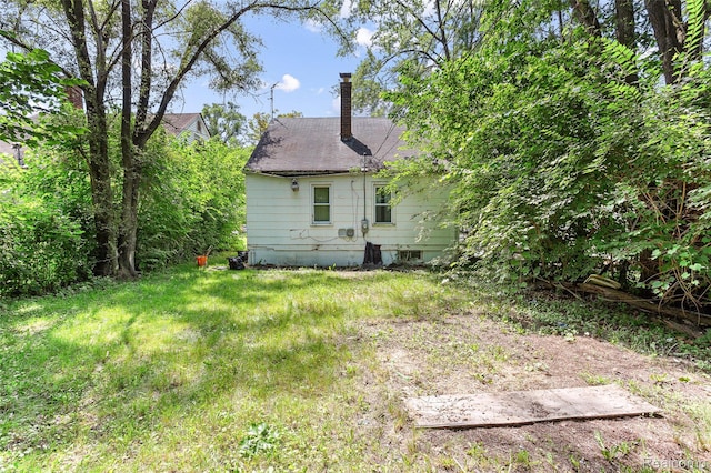 16934 Pembroke Ave, Detroit, MI 48235 - rear view of property featuring a chimney