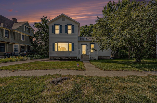 416 Kent St, Lowell, MI 49331 - traditional home with a front lawn
