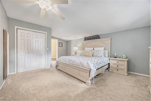 416 Kent St, Lowell, MI 49331 - bedroom with light carpet, vaulted ceiling, ceiling fan, and a closet