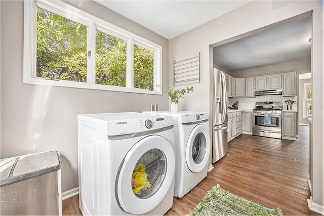 416 Kent St, Lowell, MI 49331 - laundry room with washer and clothes dryer and dark wood finished floors