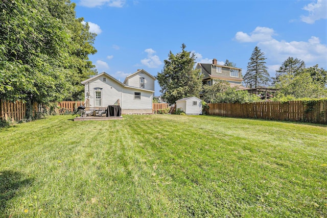 416 Kent St, Lowell, MI 49331 - fenced backyard with a storage shed and a deck