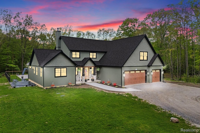 4286 Center Rd, Linden, MI 48451 - modern farmhouse style home with driveway, a chimney, a lawn, a porch, and an attached garage