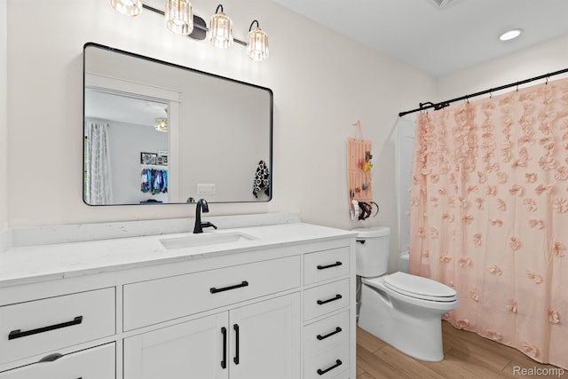 4286 Center Rd, Linden, MI 48451 - bathroom with vanity, wood finished floors, and shower / bath combo
