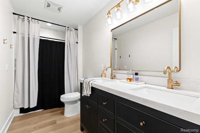 4286 Center Rd, Linden, MI 48451 - full bathroom featuring double vanity, wood finished floors, and curtained shower