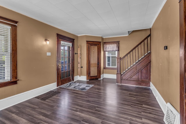 843 Center St, Jackson, MI 49202 - entrance foyer with stairs, wood finished floors, and ornamental molding