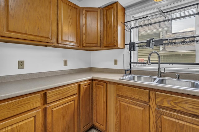 843 Center St, Jackson, MI 49202 - kitchen featuring brown cabinets and light countertops