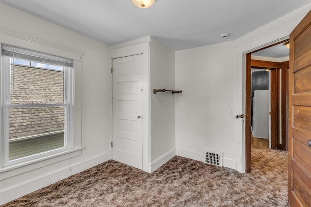 843 Center St, Jackson, MI 49202 - spare room featuring carpet and a smoke detector