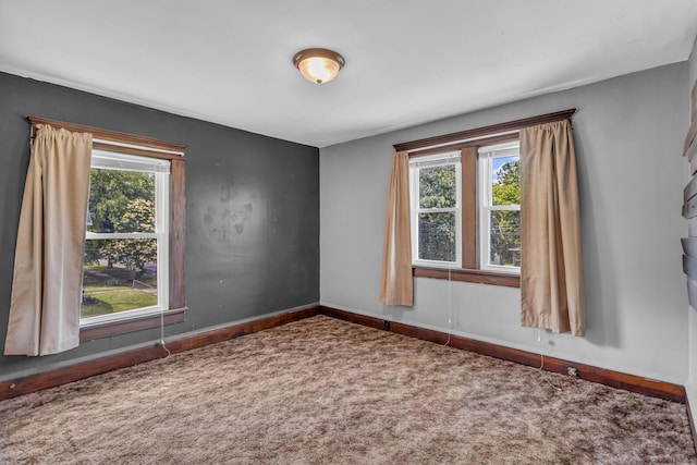 843 Center St, Jackson, MI 49202 - empty room with carpet floors and baseboards