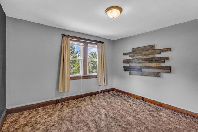 843 Center St, Jackson, MI 49202 - unfurnished room featuring baseboards and carpet