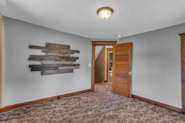 843 Center St, Jackson, MI 49202 - carpeted empty room with baseboards and a smoke detector