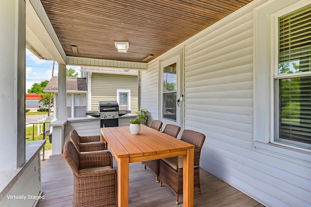 843 Center St, Jackson, MI 49202 - wooden terrace featuring area for grilling and outdoor dining space