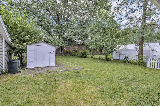 843 Center St, Jackson, MI 49202 - fenced backyard with a storage shed