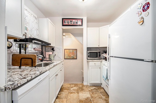 15042 Charles R Ave, Eastpointe, MI 48021 - kitchen with white appliances, white cabinetry, and light stone countertops