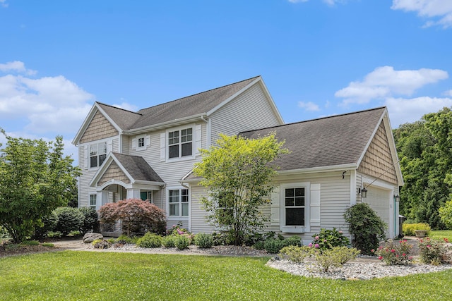 8608 52nd St SE, Ada, MI 49301 - view of front of home with a front lawn, roof with shingles, and an attached garage