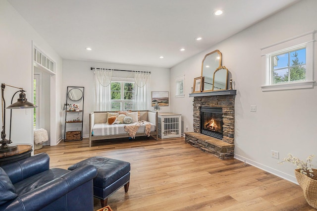 8608 52nd St SE, Ada, MI 49301 - living area featuring light wood finished floors, recessed lighting, and a fireplace
