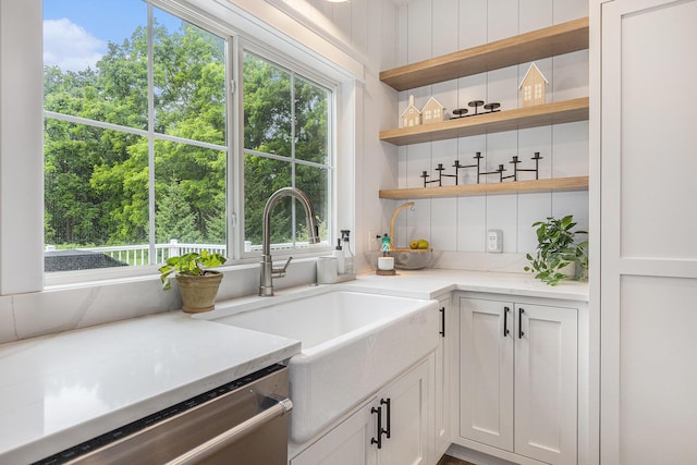 8608 52nd St SE, Ada, MI 49301 - bar area featuring stainless steel dishwasher, plenty of natural light, view of wooded area, and decorative backsplash