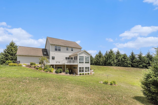 8608 52nd St SE, Ada, MI 49301 - rear view of house with a sunroom and a lawn