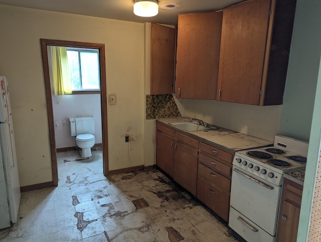 1349 Marlborough Dr, Ann Arbor, MI 48104 - kitchen featuring electric stove and brown cabinets