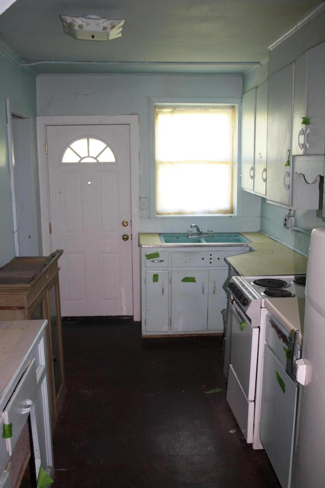 1349 Marlborough Dr, Ann Arbor, MI 48104 - kitchen featuring white electric stove, white cabinets, and light countertops