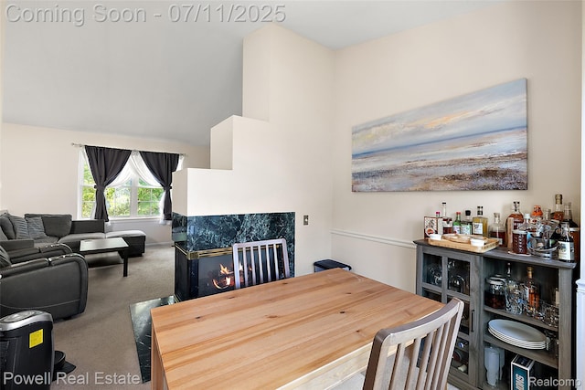 2601 Eardman Ct, Westland, MI 48186 - carpeted dining space with a bar