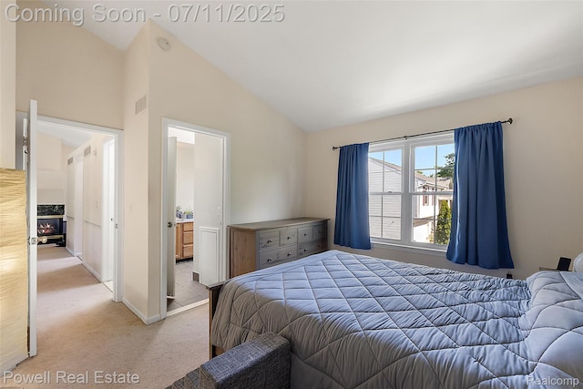 2601 Eardman Ct, Westland, MI 48186 - bedroom with light carpet, high vaulted ceiling, and ensuite bath