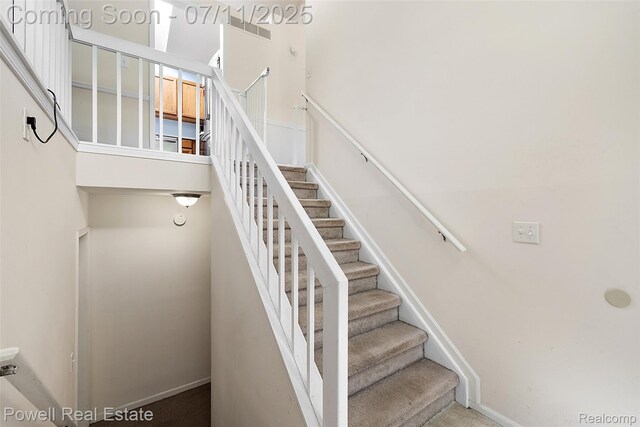 2601 Eardman Ct, Westland, MI 48186 - stairway featuring baseboards