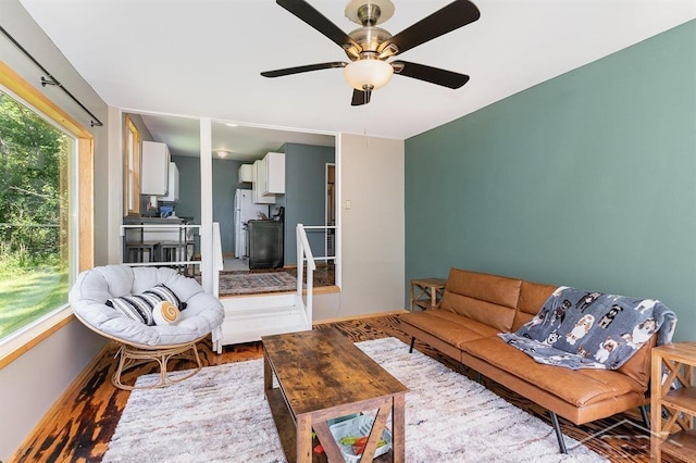 1873 Sanderson Rd, Prescott, MI 48756 - living area with ceiling fan and wood finished floors