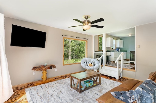 1873 Sanderson Rd, Prescott, MI 48756 - living area with a ceiling fan and wood finished floors