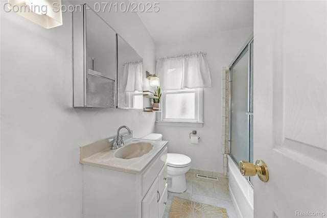 2216 Barrett Ave, Royal Oak, MI 48067 - bathroom featuring vanity, tile patterned floors, and shower / bath combination with glass door