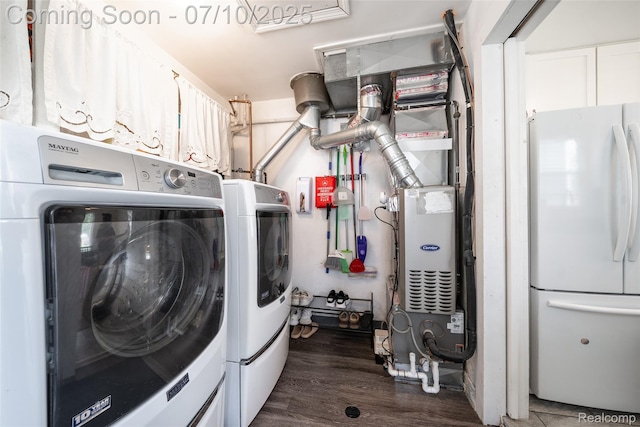 2216 Barrett Ave, Royal Oak, MI 48067 - laundry room featuring separate washer and dryer, dark wood-style floors, and heating unit