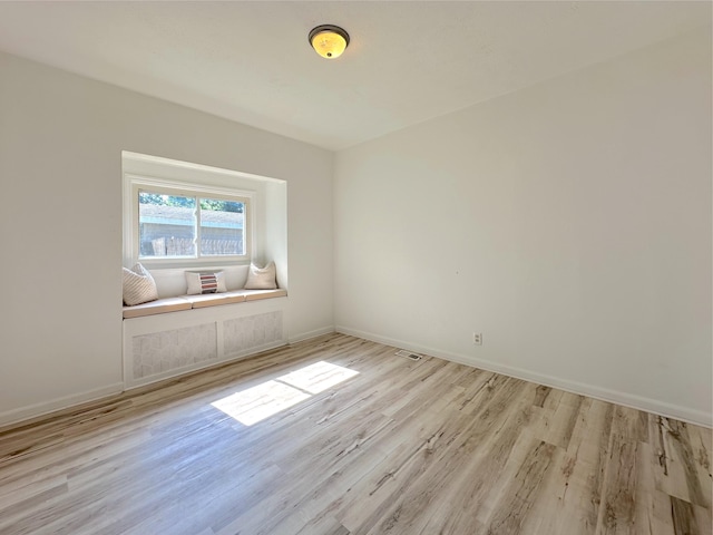 1006 Madison St, Three Rivers, MI 49093 - spare room with wood finished floors and baseboards