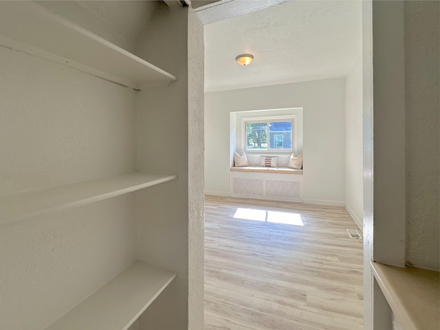 1006 Madison St, Three Rivers, MI 49093 - spacious closet featuring wood finished floors