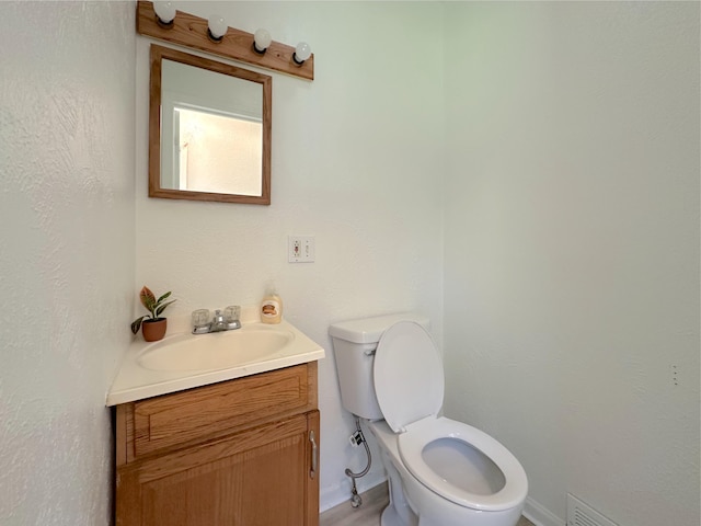 1006 Madison St, Three Rivers, MI 49093 - half bath featuring vanity and toilet