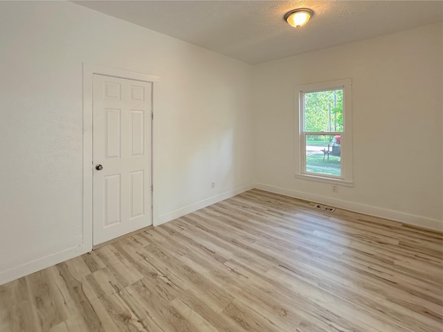 1006 Madison St, Three Rivers, MI 49093 - unfurnished room featuring light wood-style floors and a textured ceiling