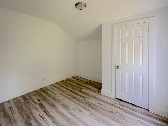 1006 Madison St, Three Rivers, MI 49093 - additional living space with vaulted ceiling and light wood-style floors