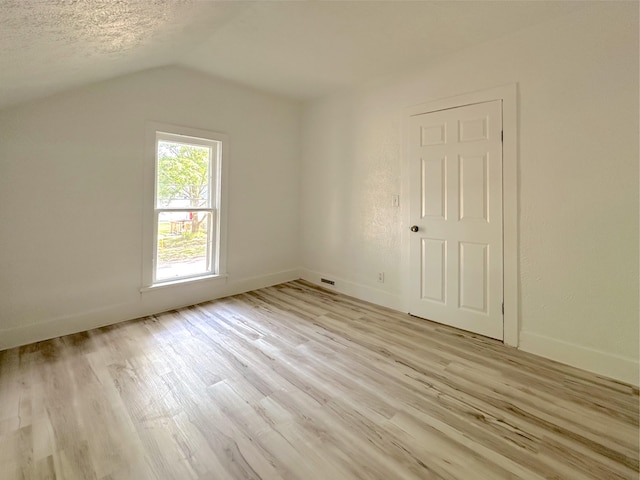 1006 Madison St, Three Rivers, MI 49093 - additional living space with lofted ceiling and light wood-style floors