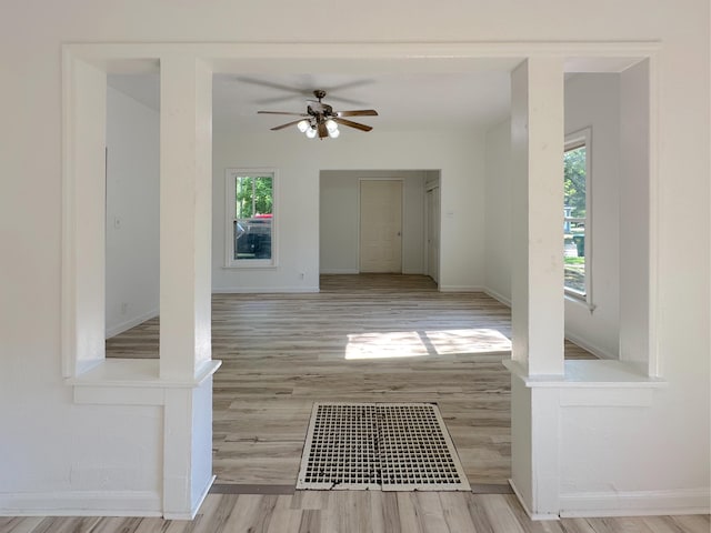 1006 Madison St, Three Rivers, MI 49093 - hallway featuring plenty of natural light and wood finished floors