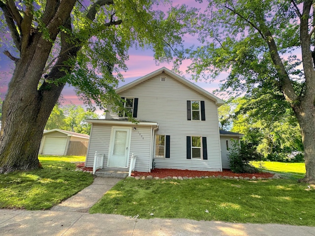 1006 Madison St, Three Rivers, MI 49093 - traditional-style home with a yard and a garage