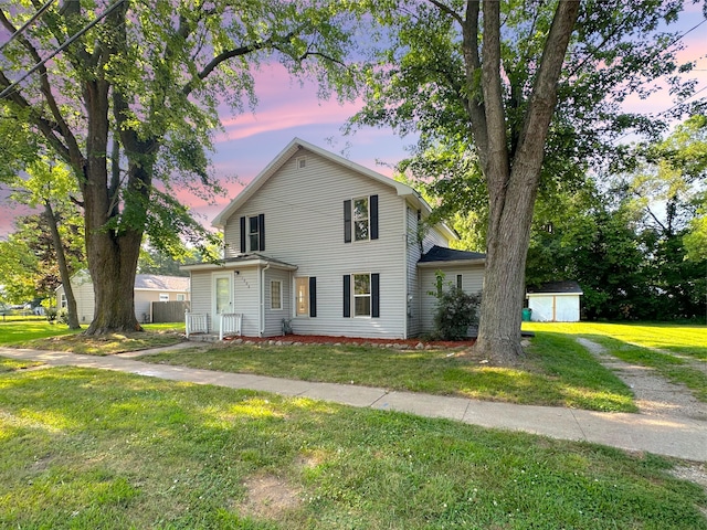 1006 Madison St, Three Rivers, MI 49093 - view of front of home featuring a lawn and a shed