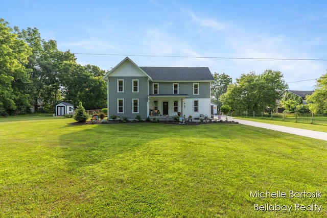 10840 Harvard Ave NE, Rockford, MI 49341 - view of front of home featuring a shed, concrete driveway, and a porch