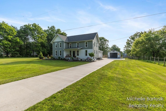 10840 Harvard Ave NE, Rockford, MI 49341 - view of front of home featuring a detached garage, driveway, and an outbuilding